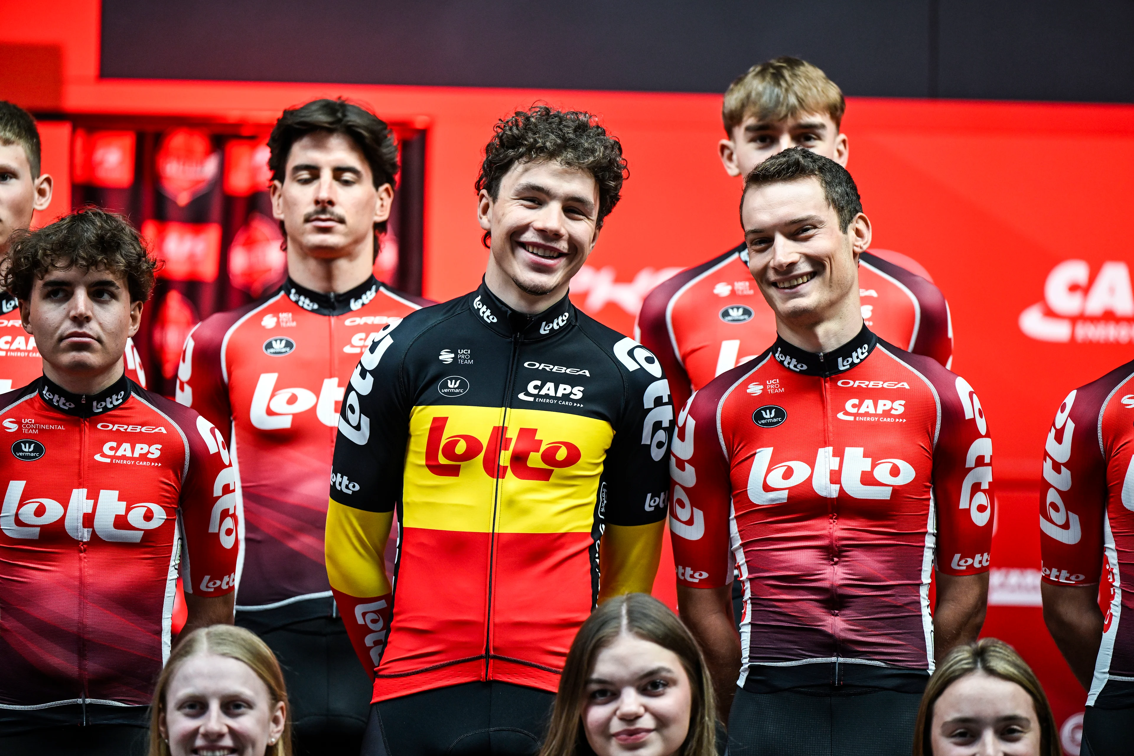 Belgian Arnaud De Lie of Lotto Dstny and other riders pose for the photographers at the Lotto Cycling Team media day, in Temse, Friday 03 January 2025. BELGA PHOTO TOM GOYVAERTS