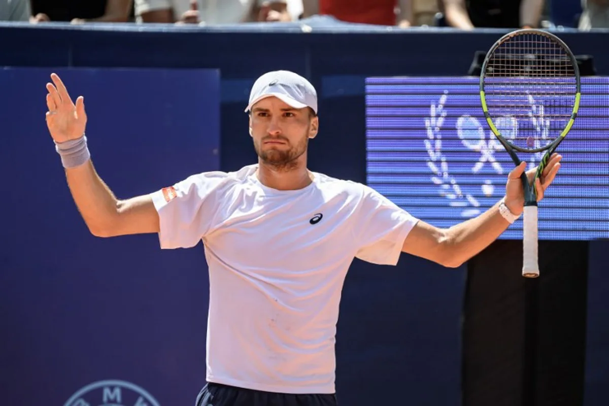 Belgium's Raphael Collignon reacts during his men's singles final match against Greece's Stefanos Tsitsipas at the Swiss Open tennis tournament in Gstaad, on July 19, 2026. Fabrice COFFRINI / AFP