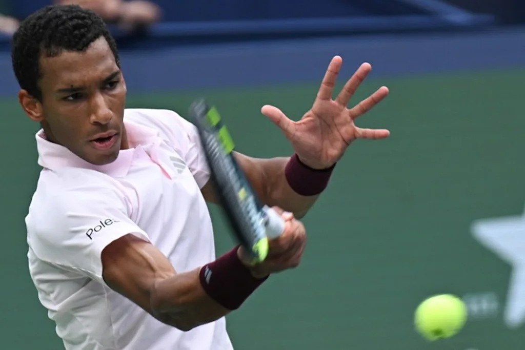 Canada's Felix Auger-Aliassime hits a return to Spain's Pablo Carreno Busta during their men's singles match at the Shanghai Masters tennis tournament in Shanghai on October 12, 2026. CN-STR / AFP