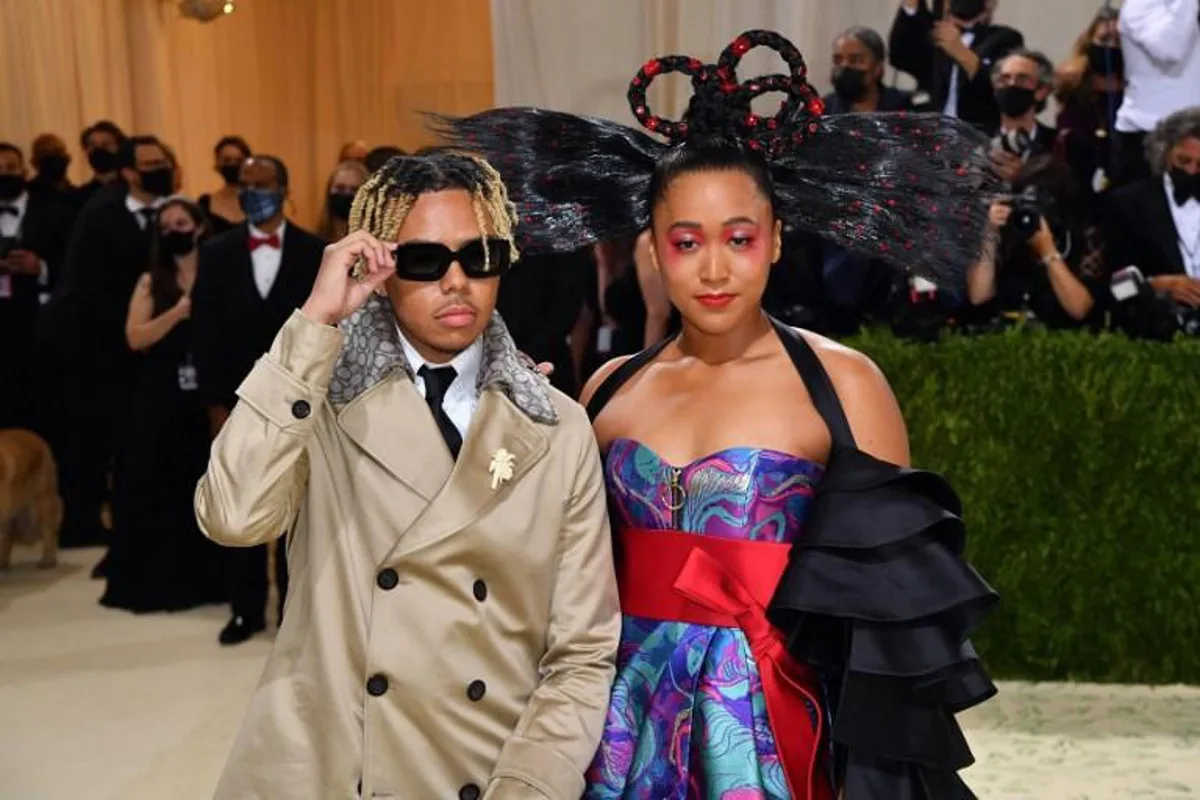 Japanese tennis player Naomi Osaka (R) and US singer Cordae arrive for the 2021 Met Gala at the Metropolitan Museum of Art on September 13, 2021 in New York. This year's Met Gala has a distinctively youthful imprint, hosted by singer Billie Eilish, actor Timothee Chalamet, poet Amanda Gorman and tennis star Naomi Osaka, none of them older than 25. The 2021 theme is In America: A Lexicon of Fashion. Angela WEISS / AFP