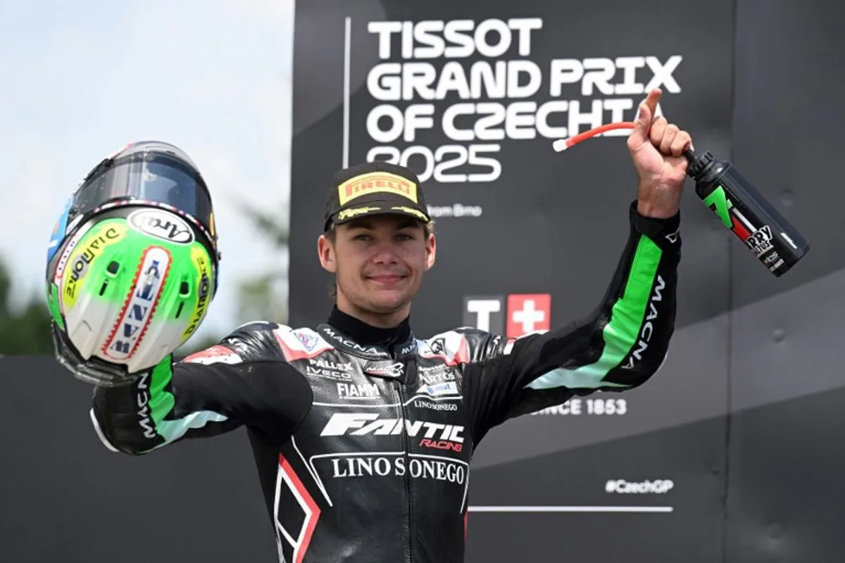 Second placed Fantic Racing Moto2 team's Belgian rider Barry Baltus celebrates on the podium after the Moto 2 Czech Grand Prix at Masaryk circuit in Brno on July 20, 2025. Michal Cizek / AFP