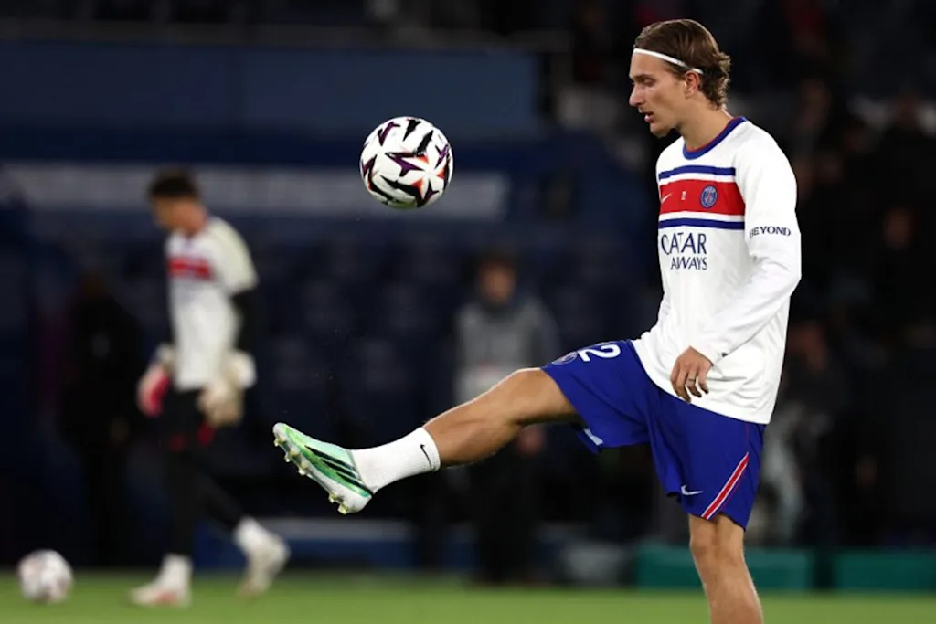 PSG's Belgian forward #22 Mika Godts controls the ball during the warm up ahead of the French L1 football match between Paris Saint-Germain (PSG) and Le Mans FC at the Parc des Princes stadium in Paris on October 10, 2026. FRANCK FIFE / AFP