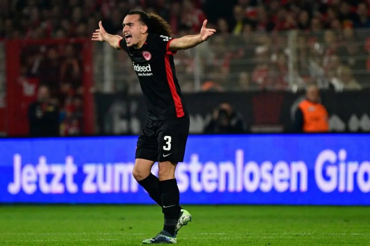 Frankfurt's Belgian defender #03 Arthur Theate reacts after being sent off during the German first division Bundesliga football match between Union Berlin and Eintracht Frankfurt in Berlin on October 27, 2024.  John MACDOUGALL / AFP