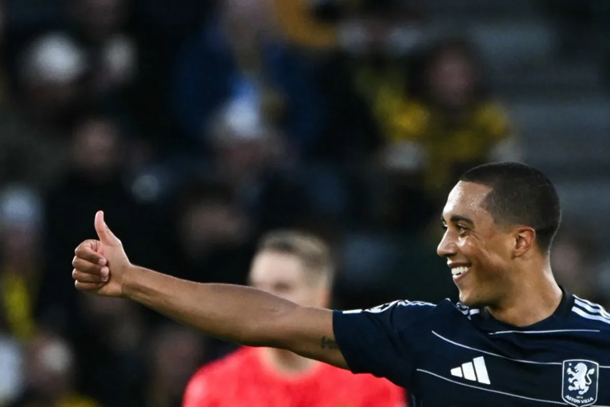 Aston Villa's Belgian midfielder #08 Youri Tielemans celebrates after opening the scoring during the UEFA Champions League 1st round day 1 football match between Young Boys and Aston Villa, at the Wankdorf Stadium in Bern, on September 17, 2024.  SEBASTIEN BOZON / AFP