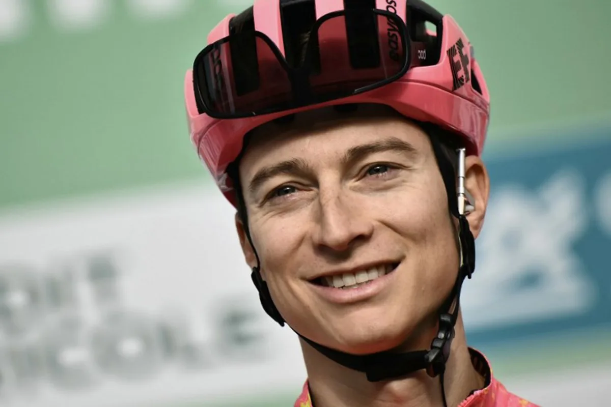 EF Education - EasyPost team's US rider Neilson Powless looks on from the presentation podium before the start of 118th edition of the Giro di Lombardia (Tour of Lombardy), a 252km cycling race from Bergamo to Como on October 12, 2024. Marco BERTORELLO / AFP