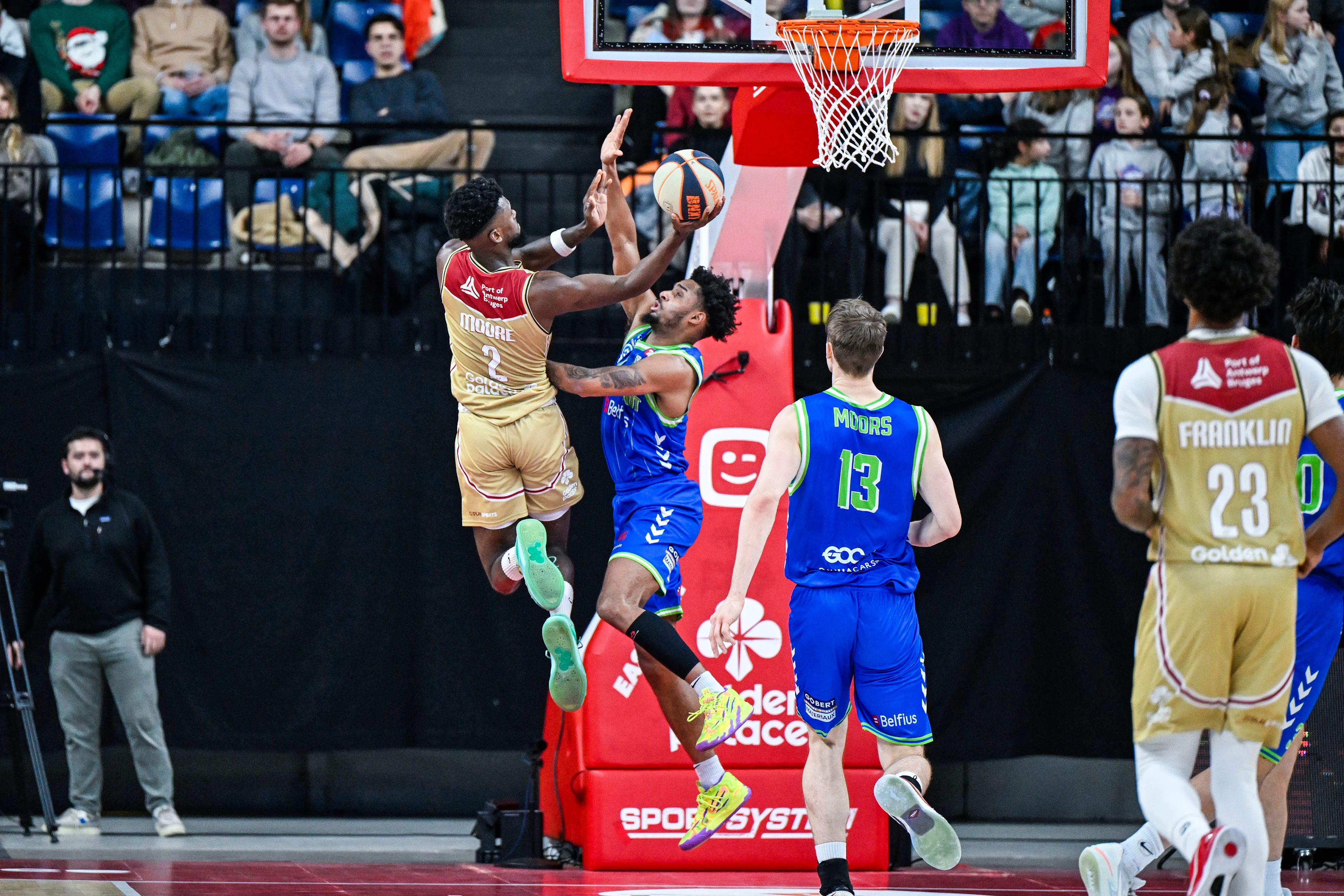 Antwerp's Michael Moore and Mons' Zaccharie Mortant pictured in action during a basketball match between Antwerp Giants and Mons-Hainaut, Friday 13 December 2024 in Antwerp, on day 5 of the 'BNXT League' first division basket championship. BELGA PHOTO TOM GOYVAERTS