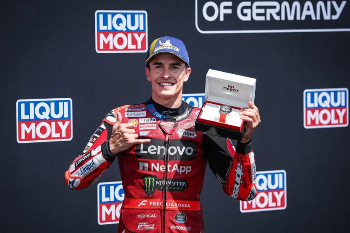 Ducati Lenovo Team's Spanish MotoGP rider Marc Marquez reacts after winning the qualifiying session of the German Motorcycle MotoGP Grand Prix at the Sachsenring race track in Hohenstein-Ernstthal near Chemnitz, eastern Germany, on July 11, 2026. Ronny HARTMANN / AFP