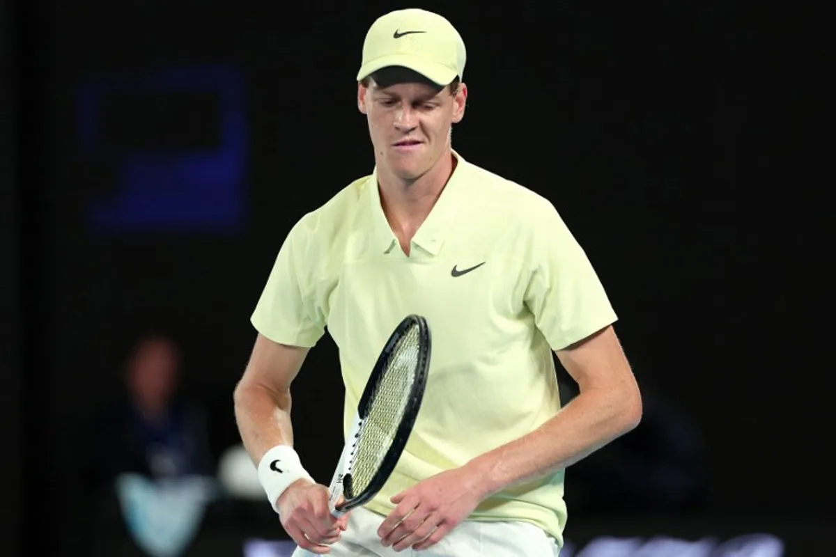 Italy's Jannik Sinner reacts to a point against Australia's Alex De Minaur during their men's singles quarter-final match on day eleven of the Australian Open tennis tournament in Melbourne on January 22, 2025.  Martin KEEP / AFP