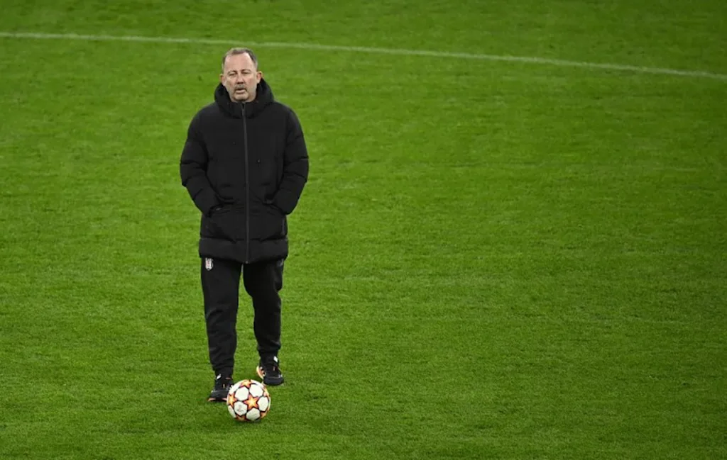 Besiktas' Turkish coach Sergen Yalcin overses a training session at the Signal-Iduna Park in Dortmund, western Germany, on December 6, 2021, on the eve of their UEFA Champions League Group C football match against Borussia Dortmund.   Ina FASSBENDER / AFP