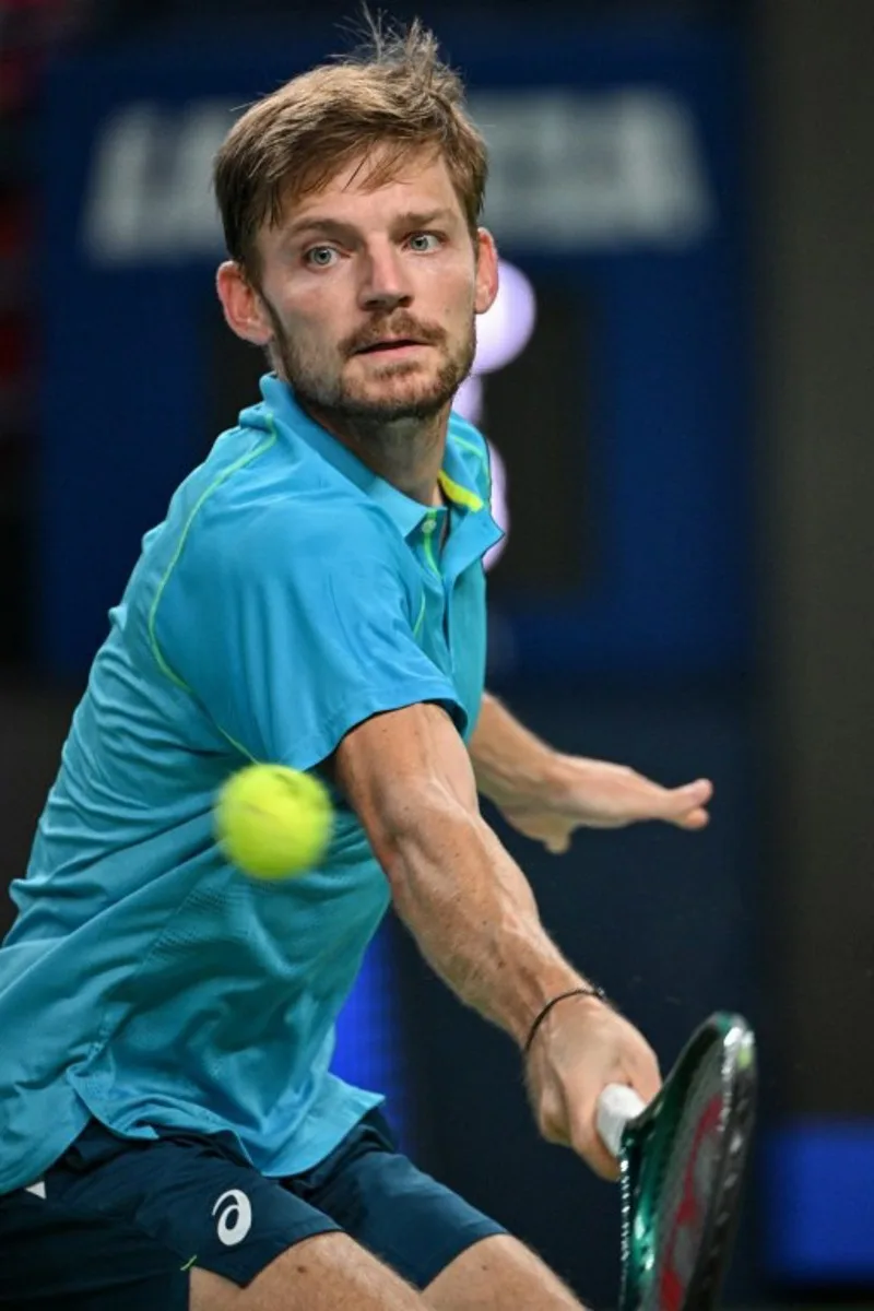 Belgium's David Goffin hits a return to Germany's Alexander Zverev during their men's singles match at the Shanghai Masters tennis tournament in Shanghai on October 9, 2024. HECTOR RETAMAL / AFP