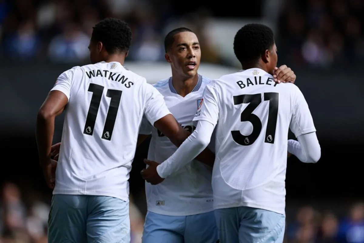 Aston Villa's English striker #11 Ollie Watkins (L) celebrates with Aston Villa's Belgian midfielder #08 Youri Tielemans (C) and Aston Villa's Jamaican striker #31 Leon Bailey after scoring the team's second goal during the English Premier League football match between Ipswich Town and Aston Villa at Portman Road in Ipswich, eastern England on September 29, 2024.  BENJAMIN CREMEL / AFP