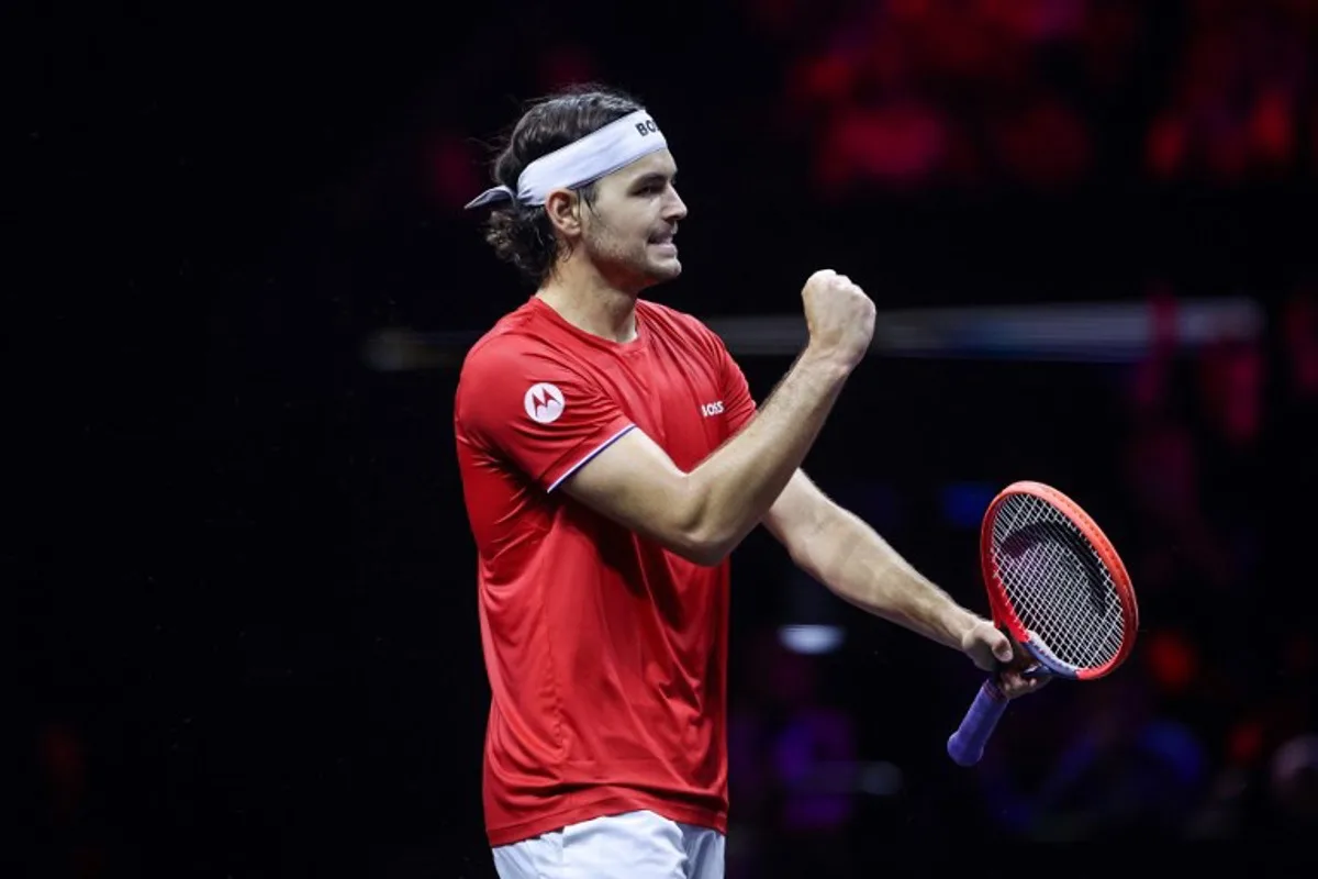 USA's Taylor Fritz of Team World celebrates winning a point against Germany's Alexander Zverev of Team Europe during their 2024 Laver Cup men's singles tennis match in Berlin, Germany on September 21, 2024. Fritz won the match 6-4, 7-5. Ronny HARTMANN / AFP