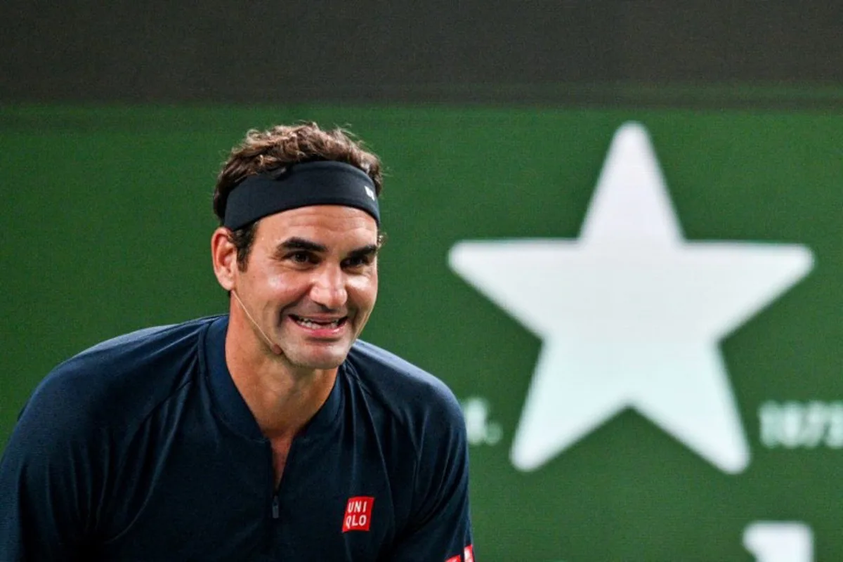Swiss Roger Federer participates in the exhibition event Roger and friends celebrity doubles match at the Shanghai Masters tennis tournament in Shanghai on October 10, 2025.  Hector RETAMAL / AFP