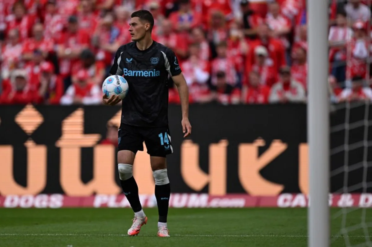 Bayer Leverkusen's Czech forward #14 Patrik Schick prepares to shoot from the penalty spot during the German first division Bundesliga football match between Mainz 05 and Bayer Leverkusen in Mainz, western Germany, on May 17, 2025.  Kirill KUDRYAVTSEV / AFP