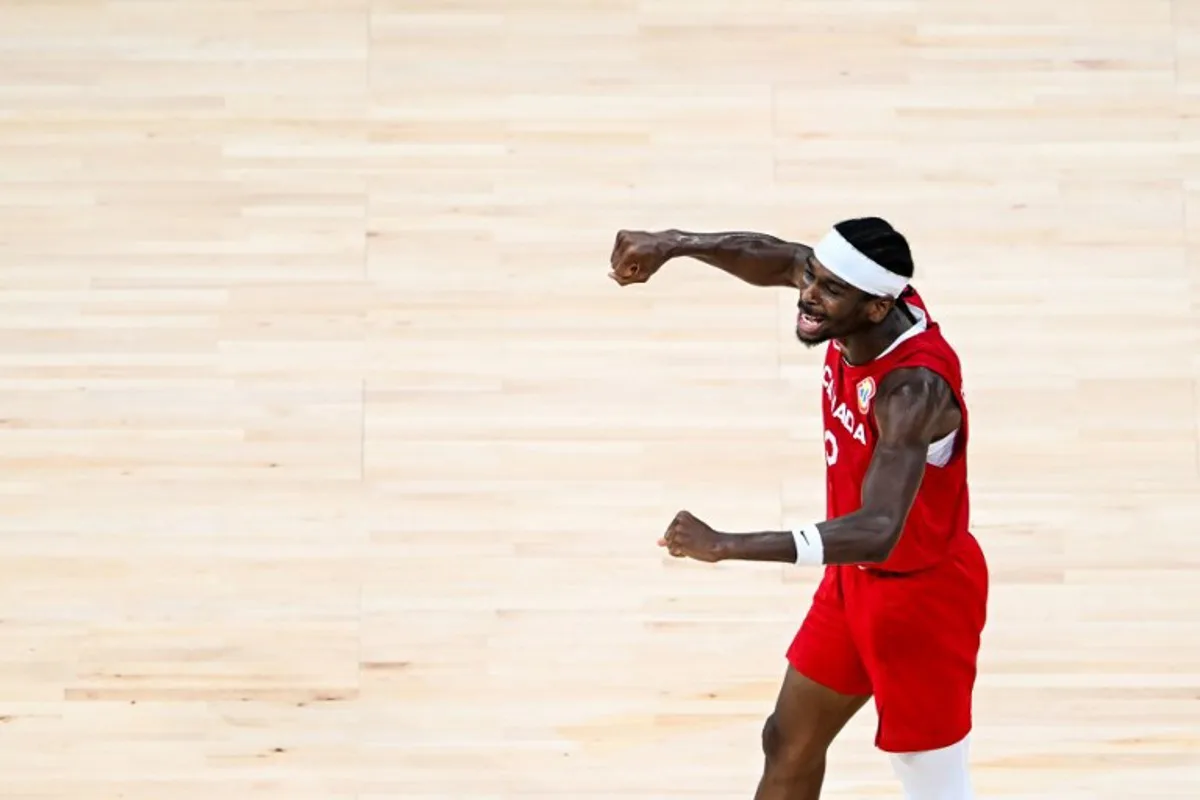 Canada's Shai Gilgeous-Alexander celebrates victory at the end of the FIBA Basketball World Cup game for third place between Canada and USA in Manila on September 10, 2023. SHERWIN VARDELEON / AFP