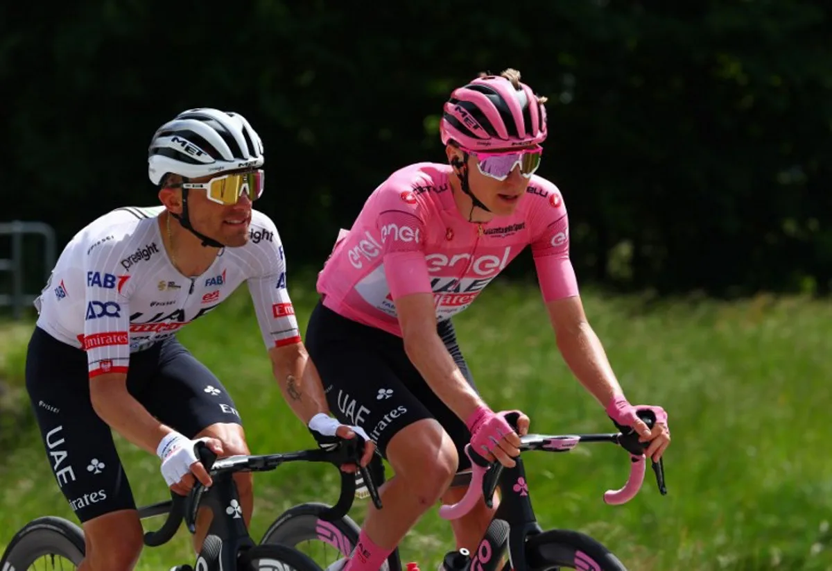 Team UAE's Slovenian rider Tadej Pogacar and Team UAE's Polish rider Rafal Majka rides during the 19th stage of the 107th Giro d'Italia cycling race, 157km between Mortegliano and Sappada on May 24, 2024. Luca Bettini / AFP