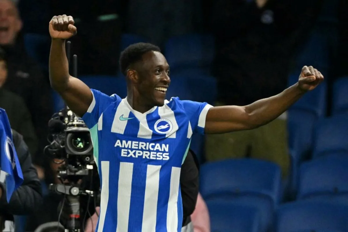 Brighton's English striker #18 Danny Welbeck celebrates after scoring their third goal during the English Premier League football match between Brighton and Hove Albion and Chelsea at the American Express Community Stadium in Brighton, southern England on April 21, 2026.  Glyn KIRK / AFP
