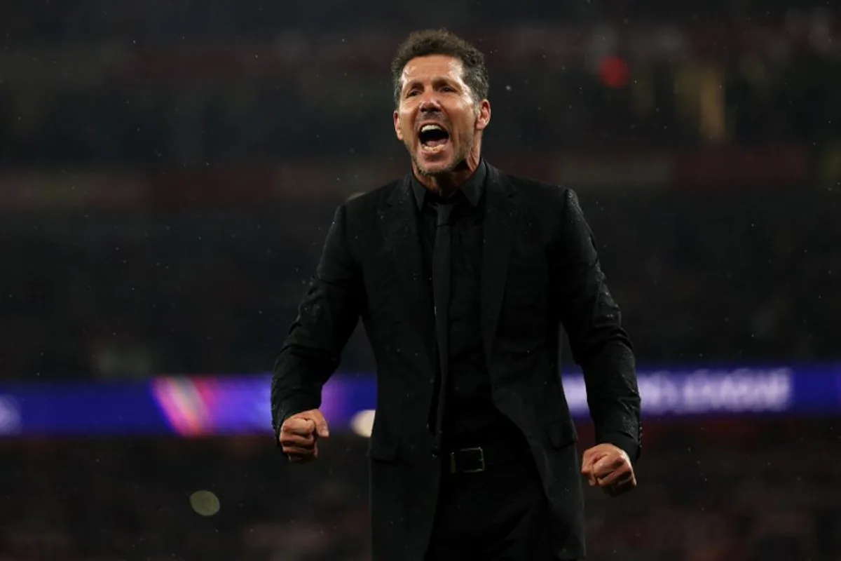 Atletico Madrid's Argentinian coach Diego Simeone reacts with the fans following the UEFA Champions League second-leg semi-final football match between Arsenal and Atletico Madrid at the Emirates Stadium in north London on May 5, 2026.  Adrian Dennis / AFP