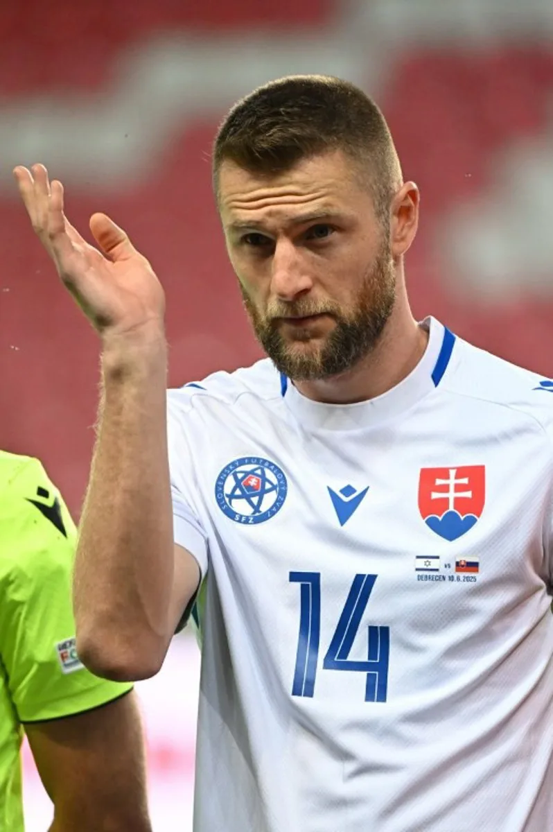 Slovakia's defender #14 Milan Skriniar stands for the national anthems prior to the international friendly football match between Israel and Slovakia in Debrecen on June 10, 2025. Attila KISBENEDEK / AFP