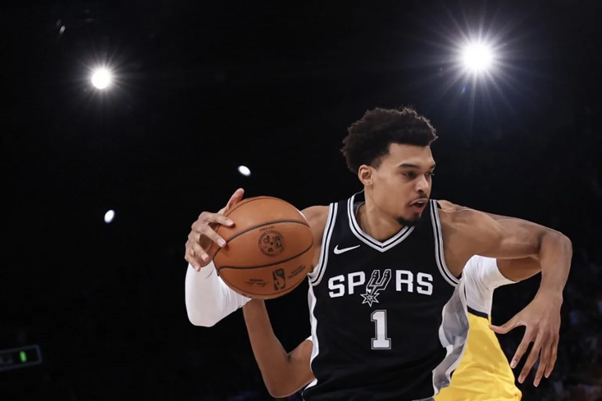 San Antonio Spurs' French forward-center #01 Victor Wembanyama handles the ball during the NBA basketball game between the Indiana Pacers and the San Antonio Spurs at the Accor Arena - Palais Omnisports de Paris-Bercy - in Paris on January 23, 2025.  Franck FIFE / AFP