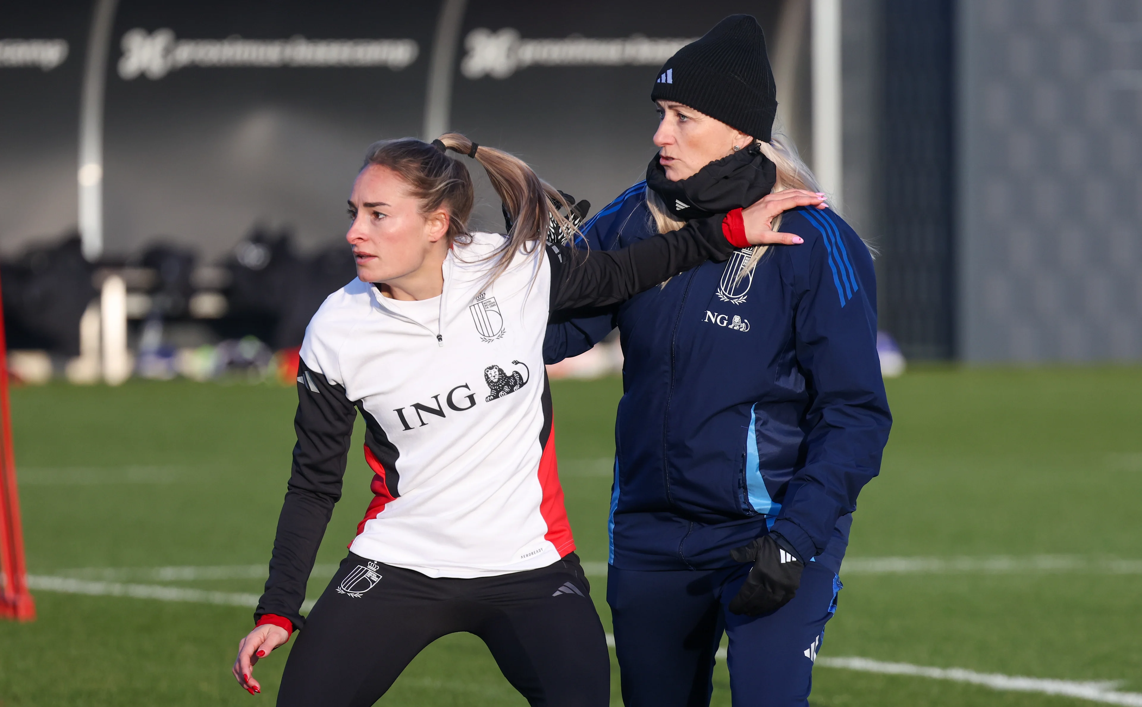 Belgium's Tessa Wullaert and Belgium's head coach Elisabet Gunnarsdottir pictured during a training session of Belgium's national women's team the Red Flames ahead of Nations League soccer games against Spain and Portugal, on Tuesday 18 February 2025 in Tubize. BELGA PHOTO VIRGINIE LEFOUR