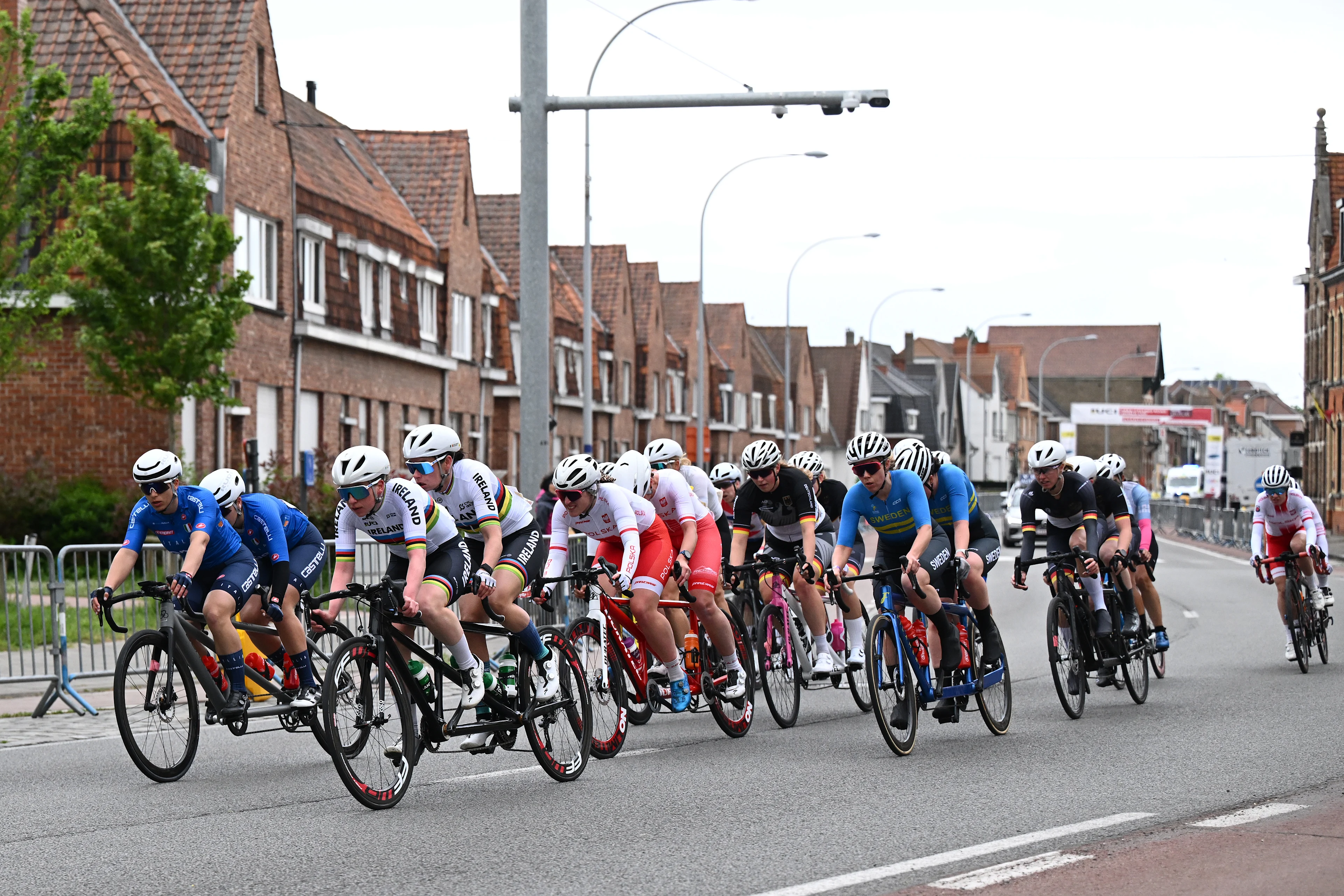 Illustration picture shows the pack of riders during the WB race at the road races at the UCI Para-Cycling Road World Cup event, Sunday 04 May 2025, in Brugge. The UCI Para-Cycling Road World Cup takes place from 01 to 04 May in Oostende and Brugge. BELGA PHOTO LUC CLAESSEN