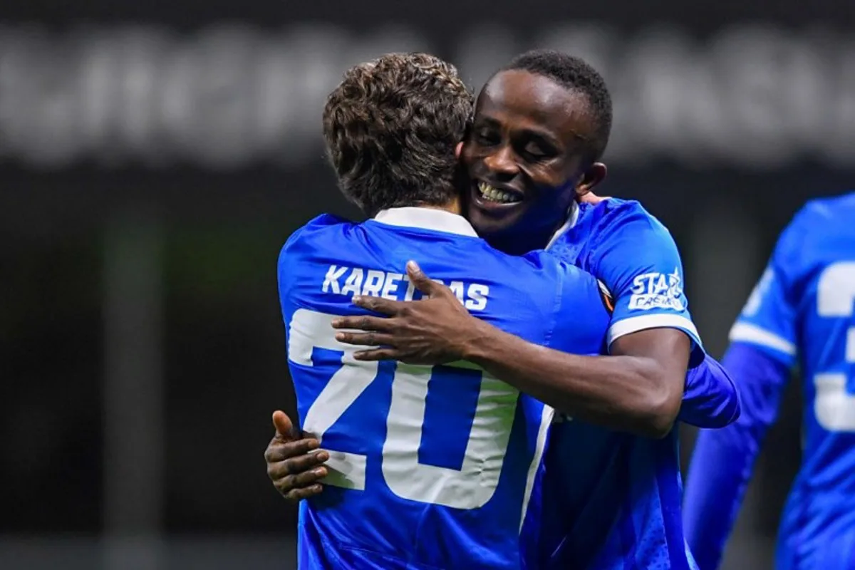RC Genk's Nigerian forward #14 Yira Sor (R) celebrates with teammate RC Genk's Greek midfielder #20 Konstantinos Karetsas after scoring their second goal during the Europa League 1st round day 4 football match between SC Braga and RC Genk at the Municipal stadium of Braga on November 6, 2025. MIGUEL LEMOS / AFP