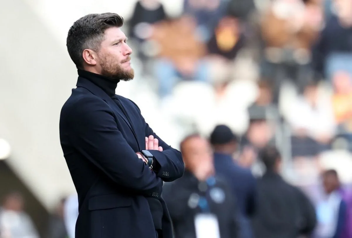 Monaco's Belgian head coach Sebastien Pocognoli looks on during the French L1 football match between Paris FC and AS Monaco at the Stade Jean-Bouin in Paris on April 10, 2026. FRANCK FIFE / AFP