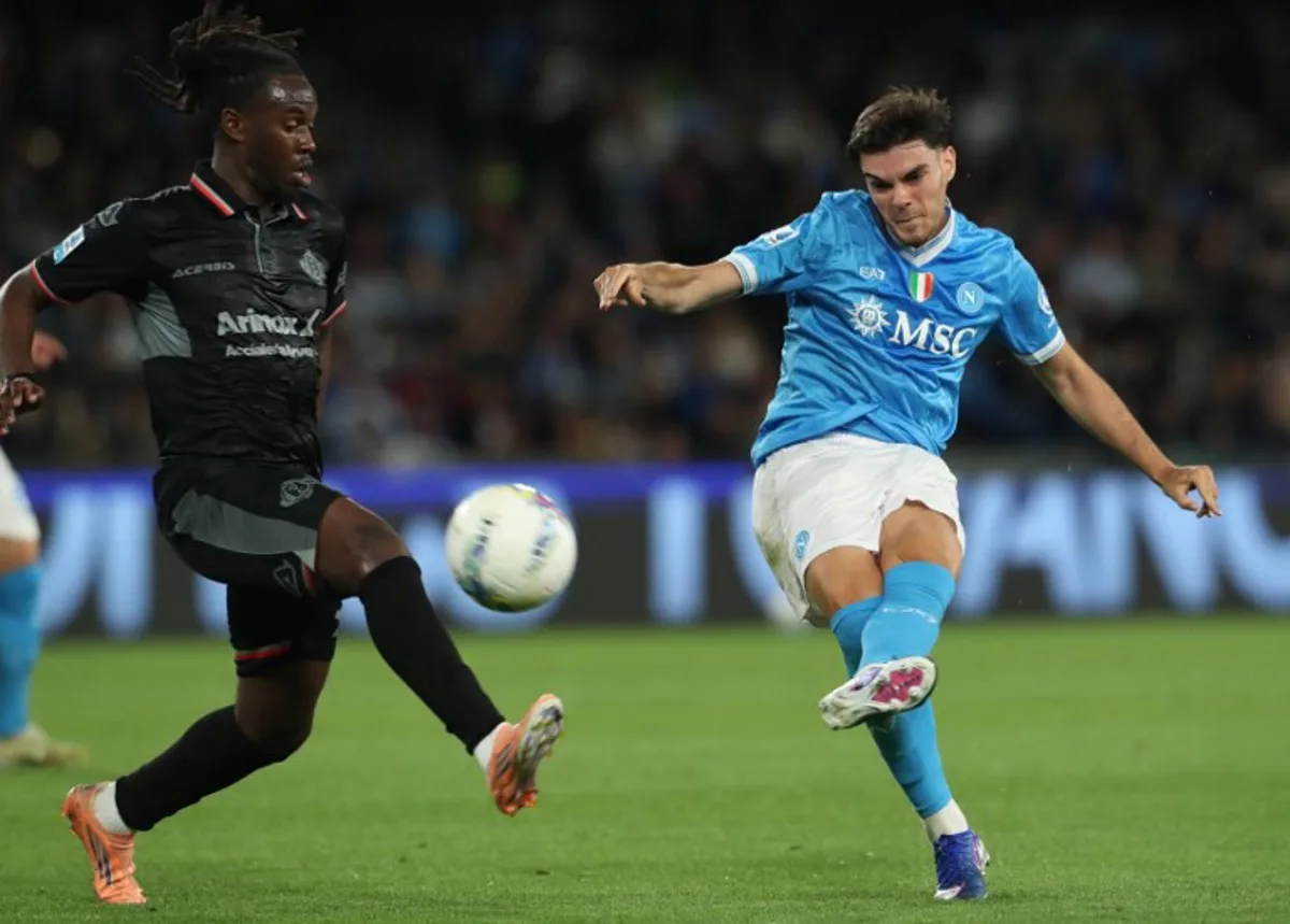 Napoli's Spanish defender #3 Miguel Gutierrez Ortega (R) kicks the ball during the Italian Serie A football between match SSC Napoli and US Cremonese at the Diego Armando Maradona Stadium in Napoli, on April 24, 2026. CARLO HERMANN / AFP