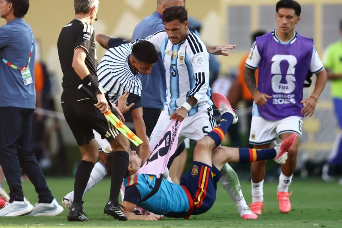 Argentina's midfielder #05 Leandro Paredes (top) clashes with Spain's midfielder #09 Gavi during the 2026 World Cup football tournament final match between Spain and Argentina at the New York/New Jersey Stadium in East Rutherford on July 19, 2026. CHARLY TRIBALLEAU / AFP