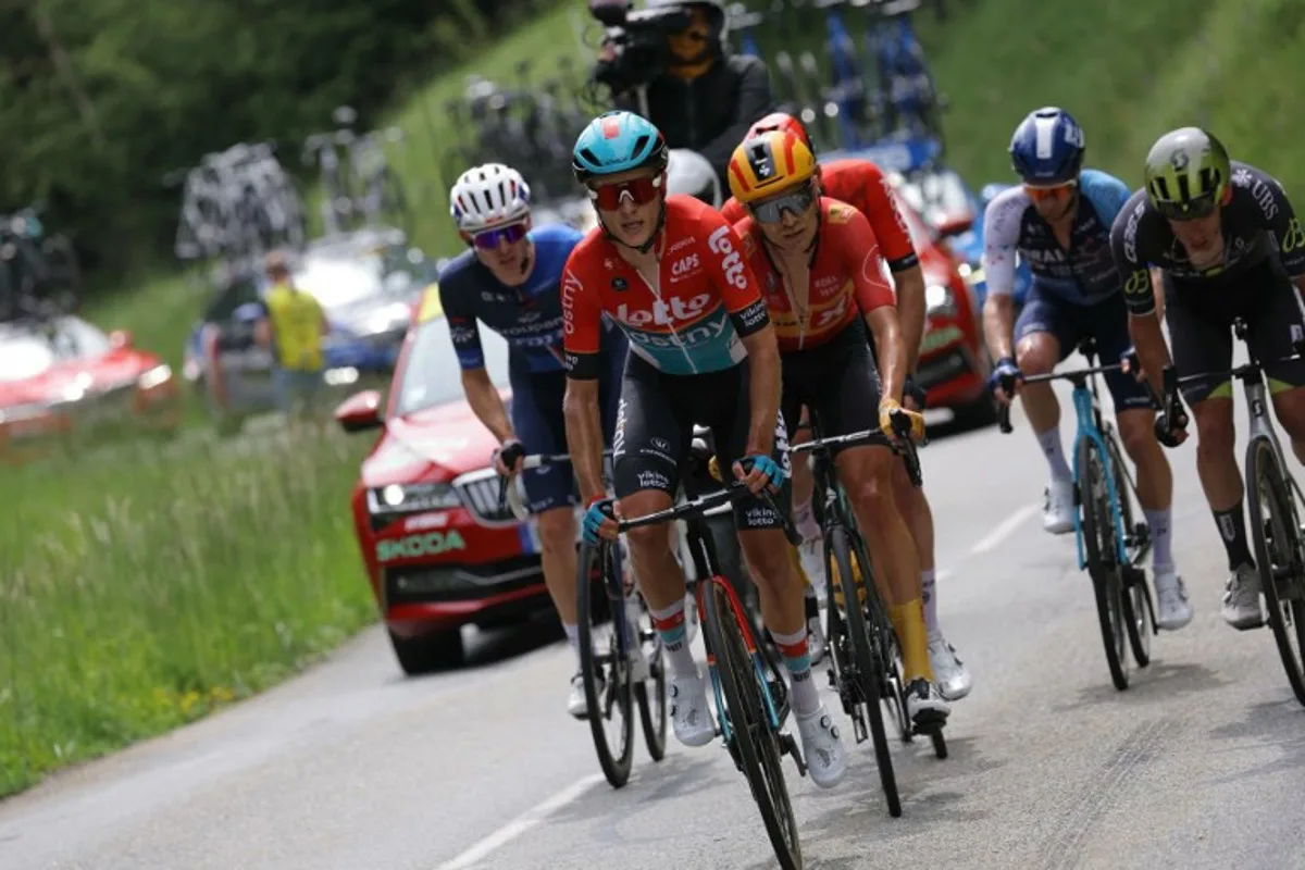 Team Lotto's Belgian rider Arjen Livyns (2ndL) rides toward the Cold du Granierin front of Team Uno-X's Danish rider Magnus Nielsen (C) in a breakaway during the sixth stage of the 76th edition of the Criterium du Dauphine cycling race, 174,1km between Hauterives and Le Collet d'Allevard, French Alps, on June 7, 2024.  Thomas SAMSON / AFP