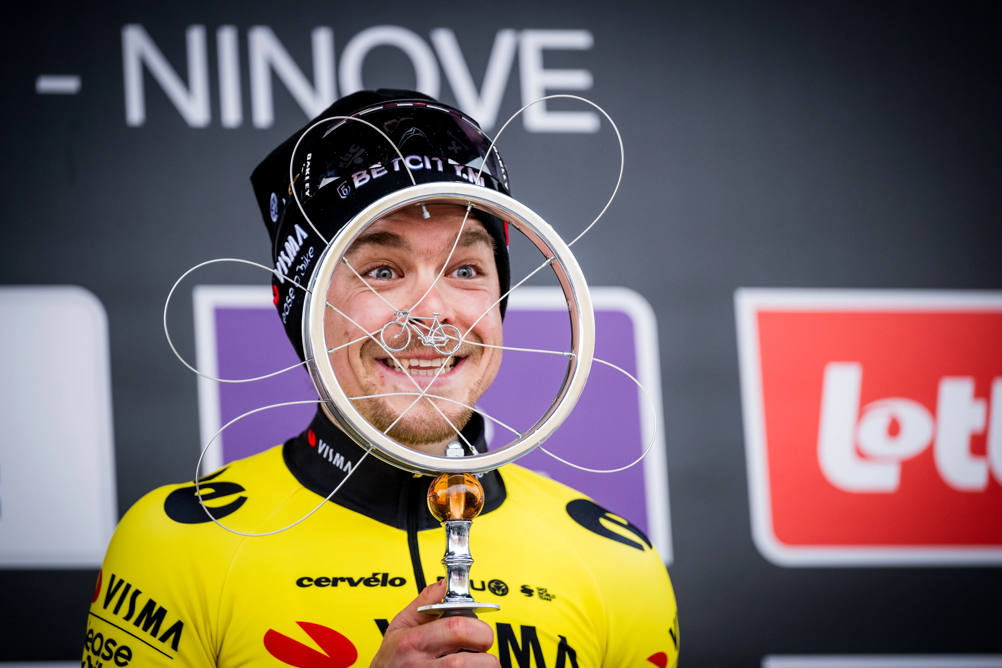 Slovenian Jan Tratnik of Team Visma-Lease a Bike celebrates on the podium after winning the 79th edition of the men's one-day cycling race Omloop Het Nieuwsblad (UCI World Tour), 202km from Gent to Ninove, Saturday 24 February 2024. BELGA PHOTO JASPER JACOBS