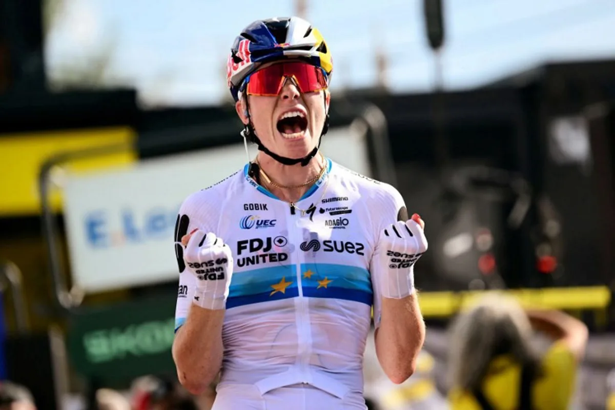 FDJ-SUEZ's Dutch rider Demi Vollering celebrates as she crosses the finish line to win the 5th (out of 9) stage of the fifth edition of the Women's Tour de France cycling race, 140 km from Macon to Belleville-en-Beaujolais, in Belleville-en-Beaujolais, central France on August 5, 2026. NICOLAS TUCAT / AFP