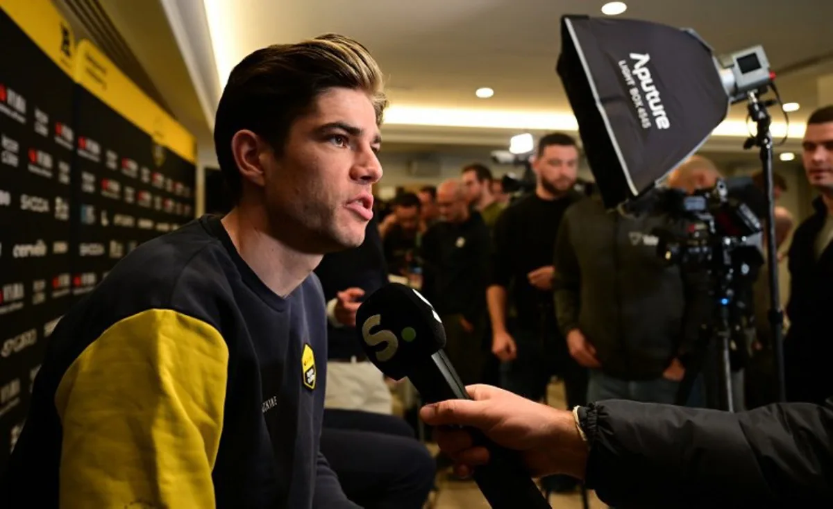 Team Visma-Lease a Bike's Belgian cyclist Wout van Aert speaks during an interview at the presentation of their team for 2025 at a hotel in La Nucia, near Alicante, eastern Spain on January 14, 2025.  JOSE JORDAN / STR / AFP