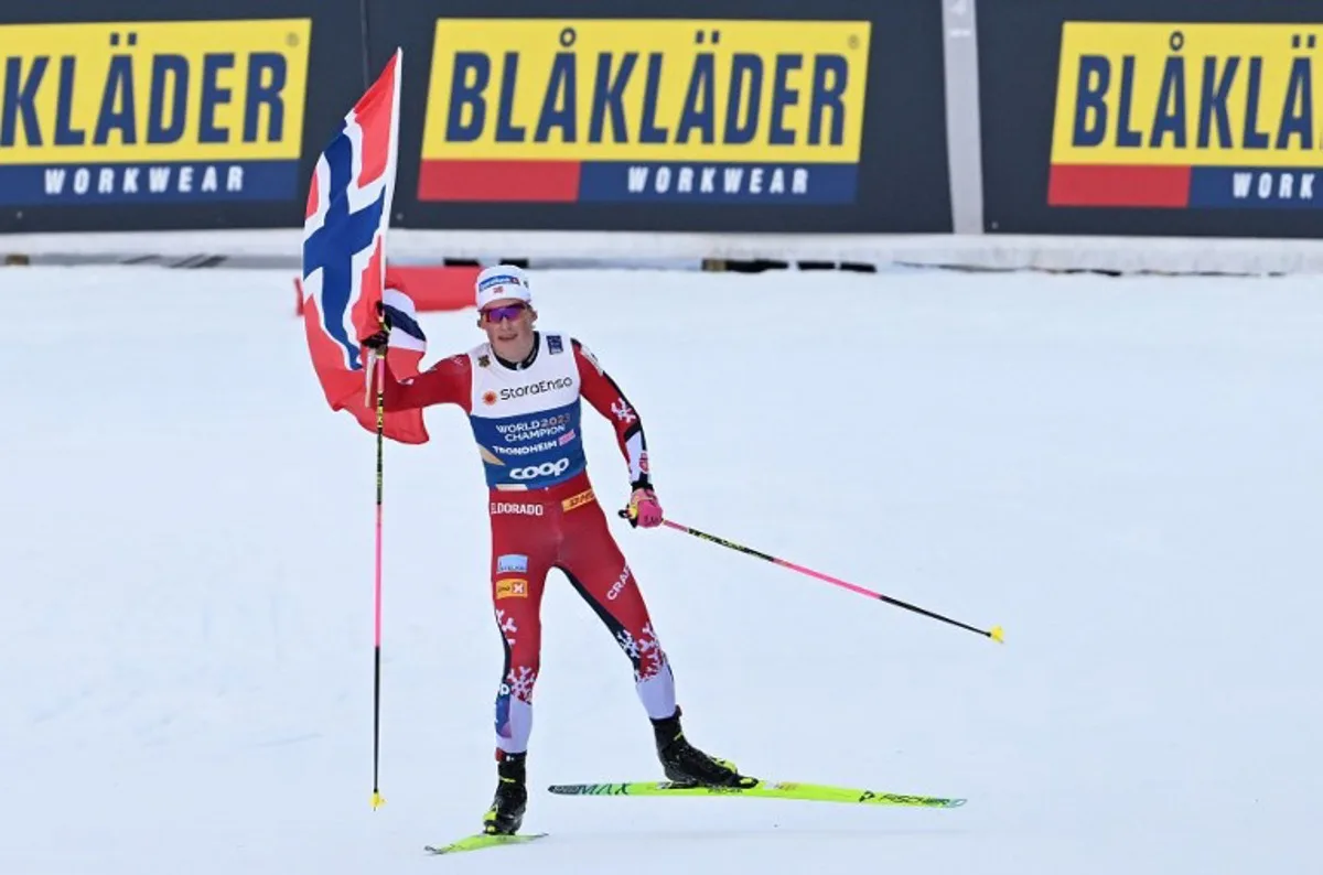 Norway's Johannes Hoesflot Klaebo celebrates winning the gold medal during the men's 4x7,5km Relay event at the FIS Cross-Country World Ski Championships in Trondheim, Norway on March 6, 2025. Norway won gold ahead of silver medallists Switzerland and bronze medallists Sweden. Jonathan NACKSTRAND / AFP