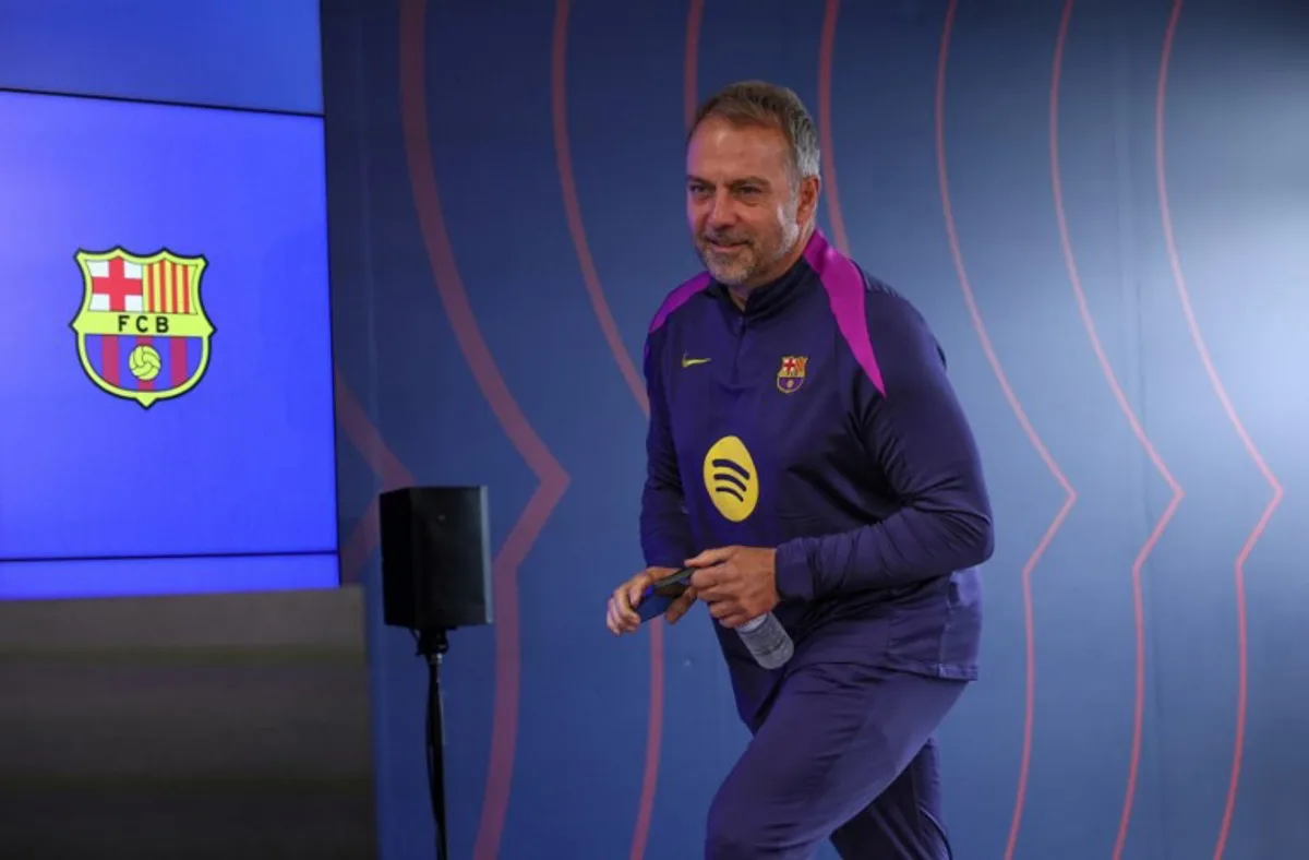 Barcelona's German coach Hans-Dieter Flick arrives to give a press conference on the eve of the Spanish league football match between FC Barcelona and Real Madrid CF at Camp Nou Stadium in Barcelona on May 9, 2026. Lluis GENE / AFP