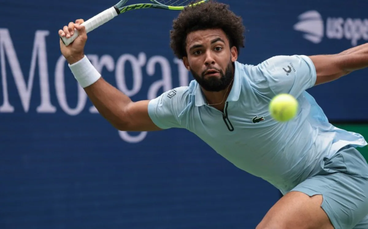 France's Arthur Fils plays a forehand return against Greece's Stefanos Tsitsipas during the men's singles first round tennis match on day two of the US Open tennis tournament at the USTA Billie Jean King National Tennis Center in New York City on August 31, 2026. KENA BETANCUR / AFP