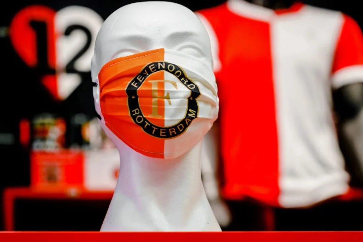 A picture taken on June 6, 2020 shows a mannequin's head with a protective face mask with the Feyenoord logo at the fanshop of the Dutch football club in Rotterdam, The Netherlands. Marco DE SWART / ANP / AFP