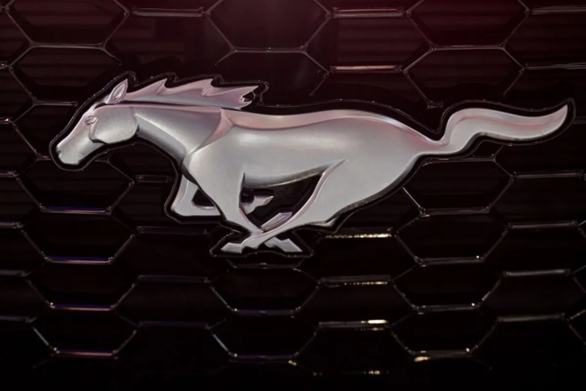 A Ford Mustang logo on is seen during the 21st Shanghai International Automobile Industry Exhibition at the National Exhibition and Convention Center in Shanghai on April 24, 2025.  Hector RETAMAL / AFP
