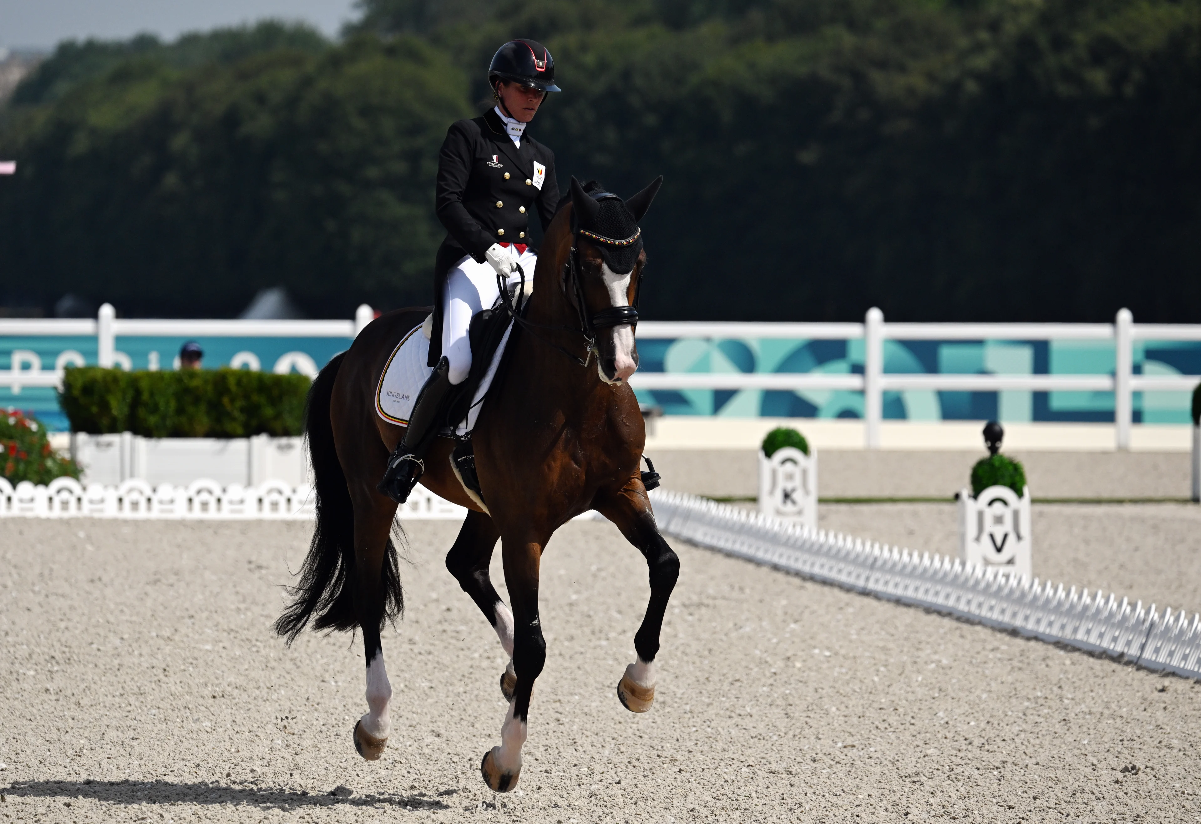 Belgian rider Larissa Pauluis pictured with the message 'I Did It' and a red heart on her riding gloves to remember her deceased husband during qualifications for the individual and team dressage equestrian event at the Chateau de Versailles in Versailles, during the Paris 2024 Olympic Games, on Tuesday 30 July 2024 in Paris, France. The Games of the XXXIII Olympiad are taking place in Paris from 26 July to 11 August. The Belgian delegation counts 165 athletes competing in 21 sports. BELGA PHOTO ANTHONY BEHAR ****** *** BELGIUM ONLY ***