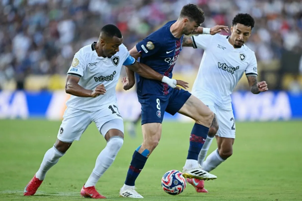 Paris Saint-Germain's Spanish midfielder #08 Fabian Ruiz, Botafogo's Brazilian midfielder #17 Marlon Freitas (L) and Brazilian midfielder #26 Gregore fight for the ball during the FIFA Club World Cup 2025 Group B football match between France's Paris Saint-Germain and Brazil's Botafogo at the Rose Bowl stadium in Los Angeles on June 19, 2025. YURI CORTEZ / AFP
