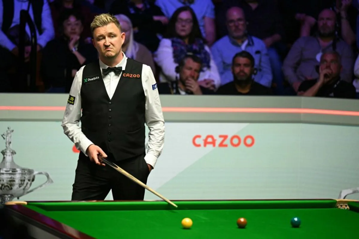 England's Kyren Wilson considers a shot on day two of his World Championship Snooker final  against Wales' Jak Jones during the evening session at The Crucible in Sheffield, northern England on May 6, 2024.   Oli SCARFF / AFP