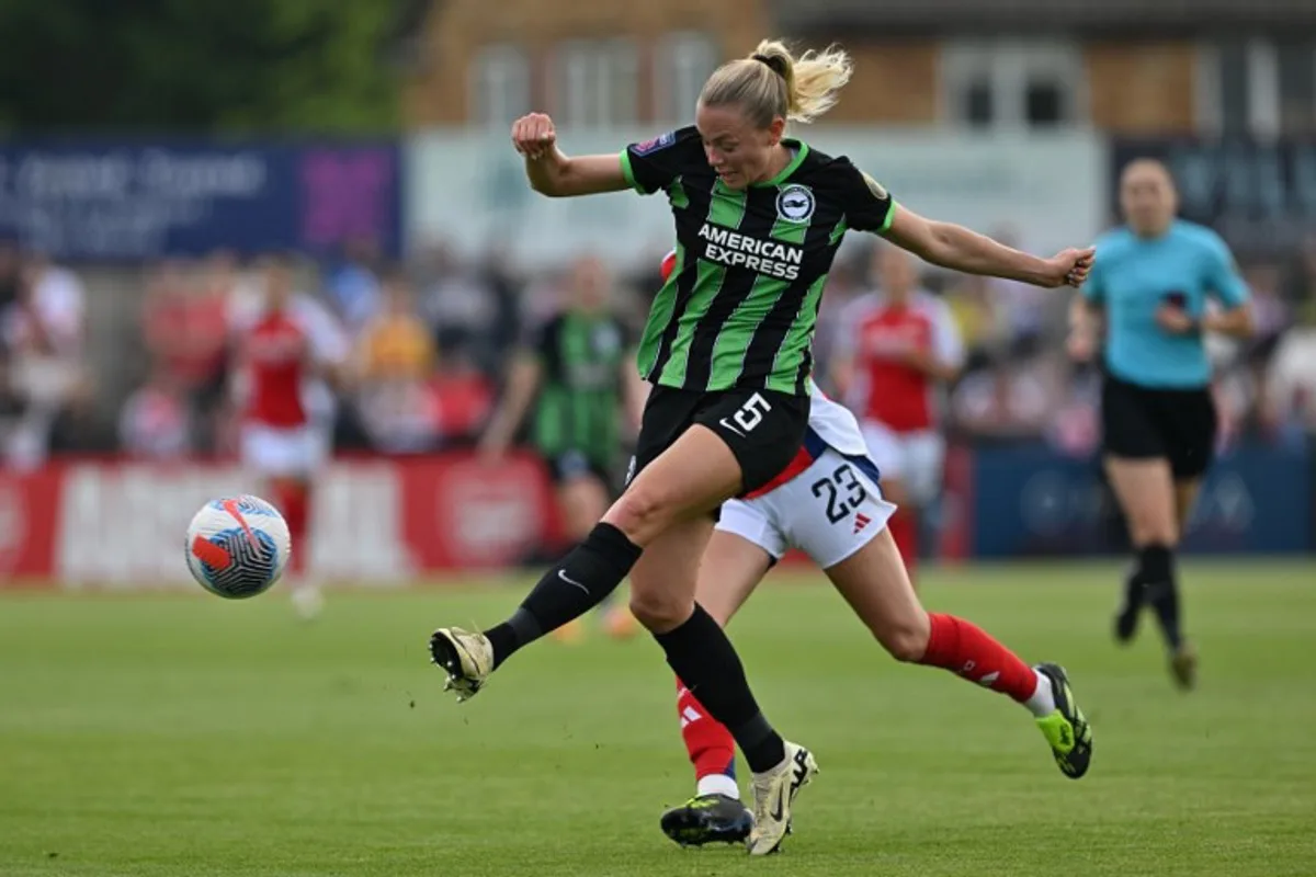 Brighton's Norwegian defender #05 Guro Bergsvand clears the ball during the English Women's Super League football match between Arsenal and Brighton and Hove Albion at Meadow Park, in Borehamwood, on May 18, 2024.  Glyn KIRK / AFP