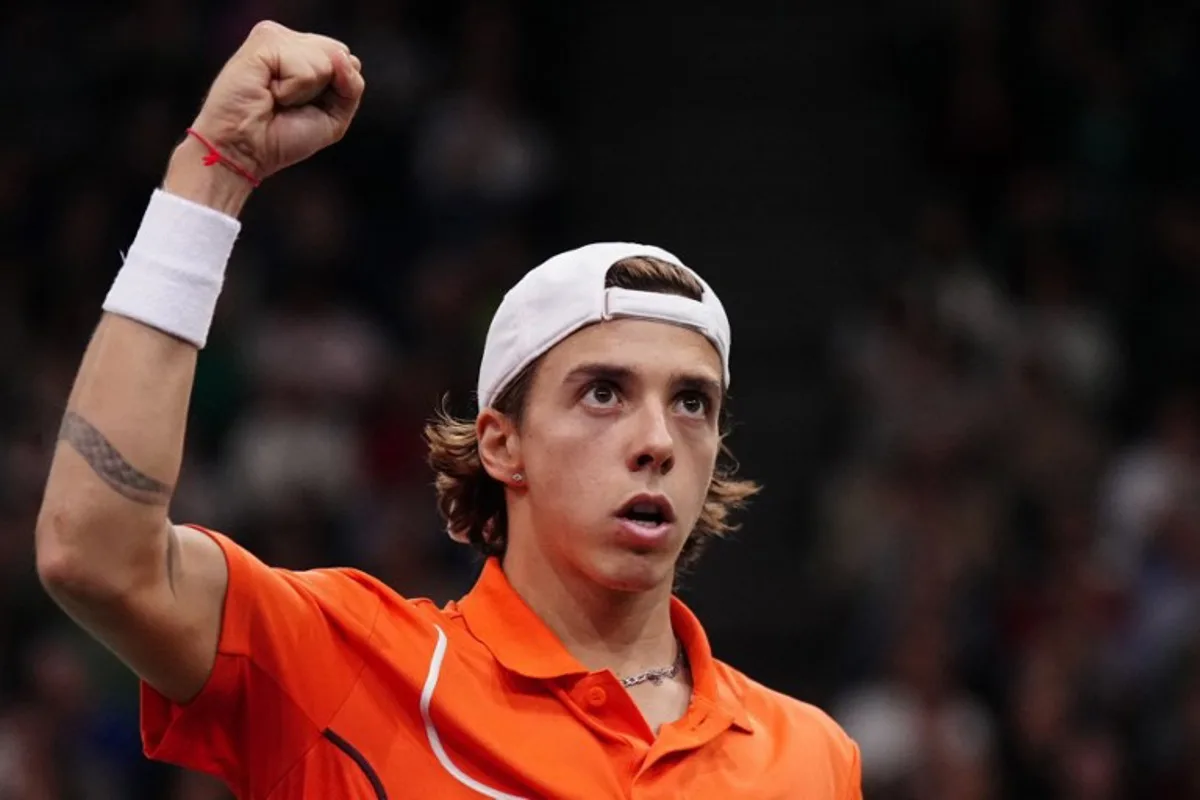 France's Arthur Cazaux celebrates after a point as he plays against US' Ben Shelton during their men's singles match on day three of the Paris ATP Masters 1000 tennis tournament at the Accor Arena - Palais Omnisports de Paris-Bercy - in Paris on October 30, 2024.  Dimitar DILKOFF / AFP