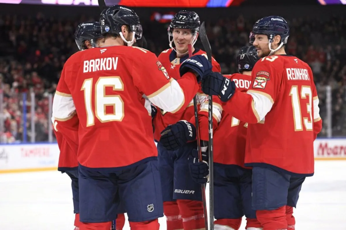 Dmitry Kulikov, Aleksander Barkov, Niko Mikkola (77), Evan Rodrigues and Sam Reinhart (13) of Florida celebrate the opening 0-1 goal by Rodrigues during the NHL Global Series Ice Hockey match Dallas Stars vs Florida Panthers in Tampere, Finland on November 2, 2024. Heikki Saukkomaa / Lehtikuva / AFP