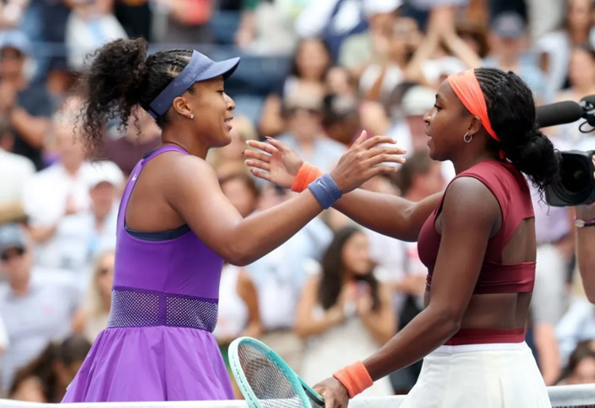 Japan's Naomi Osaka (L) and USA's Coco Gauff hug at te net after Osaka's victory during their women's singles round of 16 tennis match on day nine of the US Open tennis tournament at the USTA Billie Jean King National Tennis Center in New York City, on September 1, 2025. TIMOTHY A.CLARY / AFP