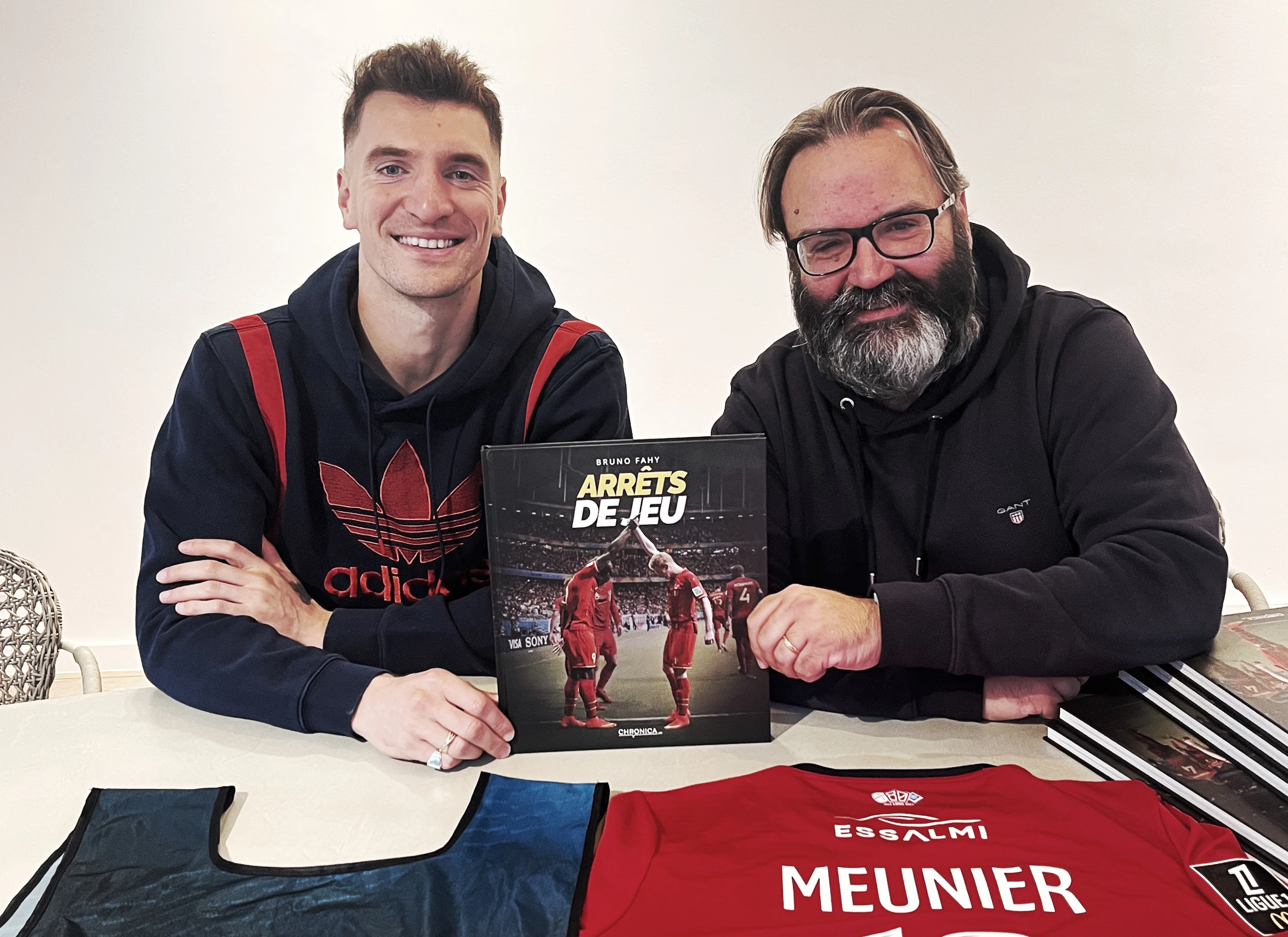 Belgian soccer player Thomas Meunier and photographer Bruno Fahy pose for the photographer at the presentation of the 'Arrets de jeu' photobook, Friday 08 November 2024 in Brussels. BELGA PHOTO HANDOUT BRUNO FAHY