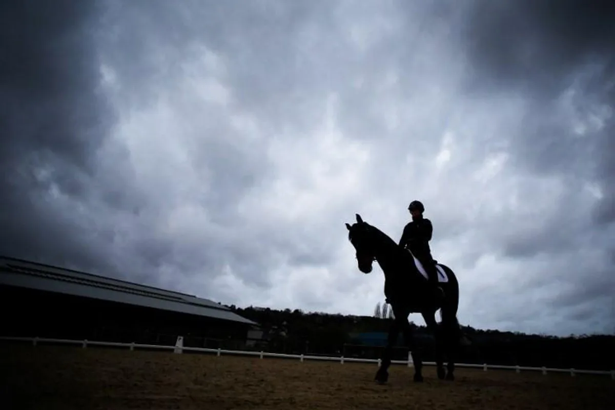 A rider exercises a horse at the Pole International du Cheval (International Horse Center) on April 4, 2018 the day before the official start of the 7th Deauville CPEDI (International Para-Equestrian Dressage Competition) in the northwestern French city of Deauville. The best French para-equestrian dressage riders will compete in the CPEDI, each hoping to win a place on the French team to compete in September 2018 in the International Equestrian Federation (FEI) World Equestrian Games in Tyron, North Carolina. CHARLY TRIBALLEAU / AFP