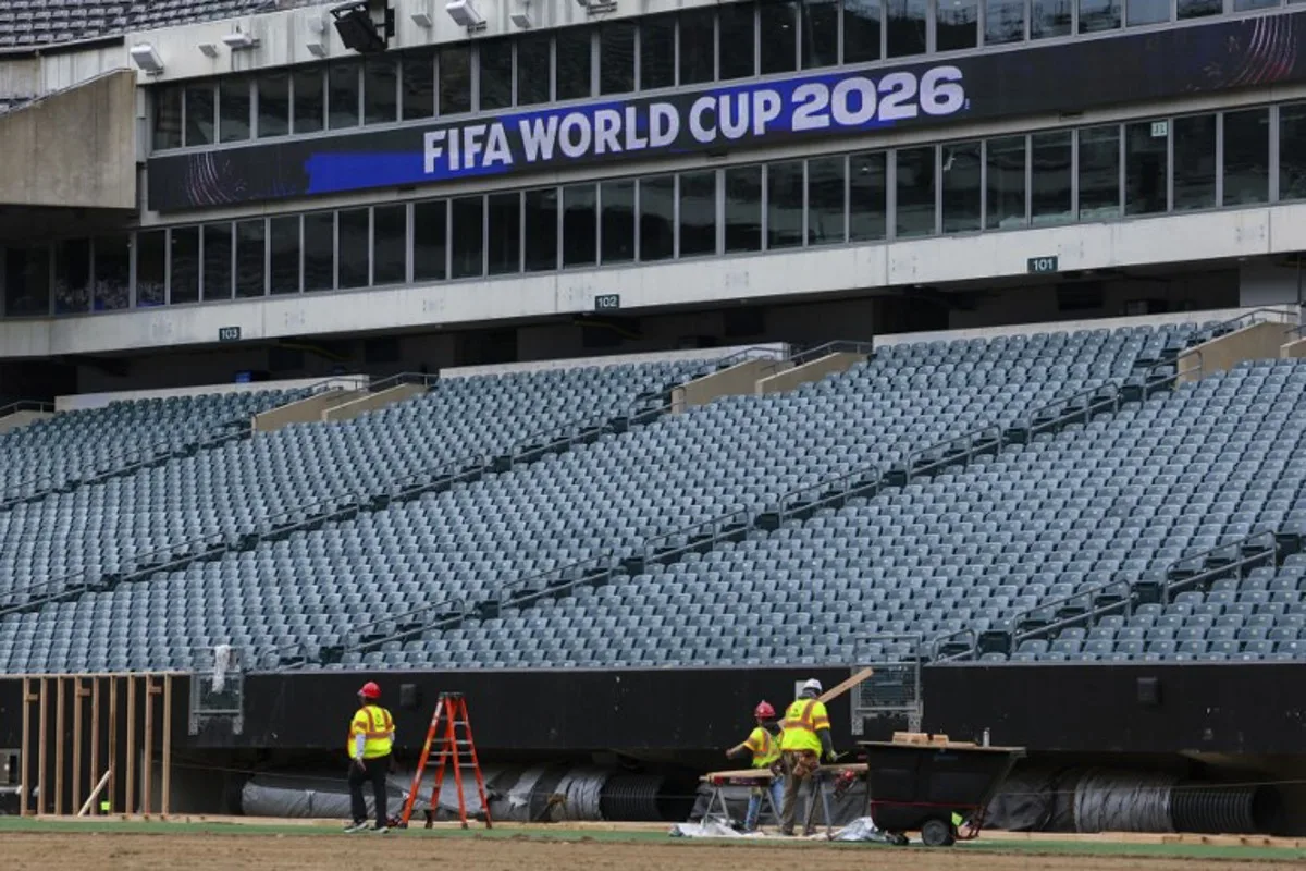 Workers prepare the field at Lincoln Financial Field, one of the stadiums hosting the 2026 FIFA World Cup at Lincoln Financial Field in Philadelphia, on April 28, 2026.  ANGELA WEISS / AFP
