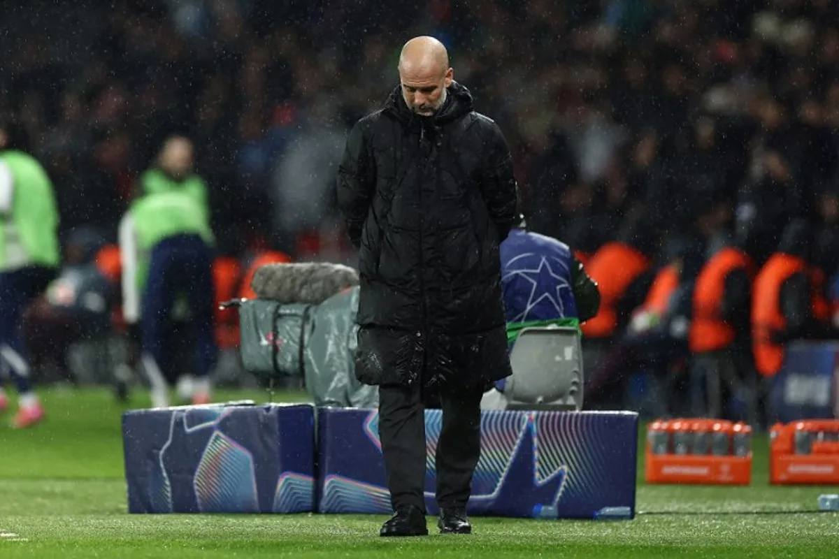 Manchester City's Spanish manager Pep Guardiola gestures during the UEFA Champions League, league phase football match between Paris Saint-Germain and Manchester City at the Parc des Princes Stadium in Paris on January 22, 2025.   FRANCK FIFE / AFP